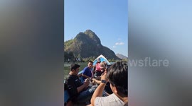Passing sports team save couple drowning in Thai border river