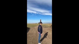 A dangerous stunt involving a bottle on his head being knocked off by a car