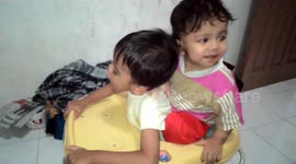 Playing with my sister in a narrow baby walker