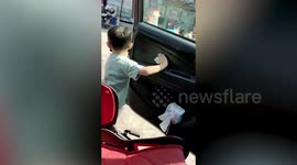 Sweet little boys asks father for money and gives it to garbage man