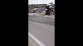 Cement mixer machine at construction site in India . Cement mixer at work at an Indian worker