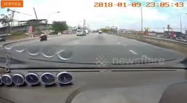 Flying gypsum board hits motorcycle rider