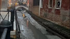 Venice's canals dry as Italian city is hit by low tide