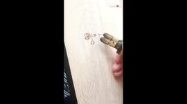 Polished pyrography artist flawlessly burns an icon of 'John the Baptist' on linden wood