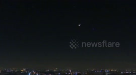 Jupiter and Venus in conjunction with moon seen clearly above St Petersburg, Russia