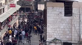 Palestinians inspect the damaged following an Israeli raid in the West Bank city of Nablus