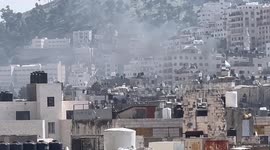 Palestinians clash with forces during the Israeli raid in the West Bank city of Nablus