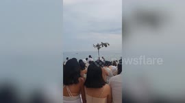 Hilarious moment banana boat gate crashes beach wedding vows