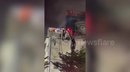 Pet dog trapped in burning building carried on cherry picker and revived with CPR