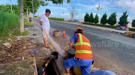 Cleaners remove dirt from blocked sewers in Vietnam