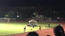 Playful dog interrupts competition and joins athletes for final 100 metres