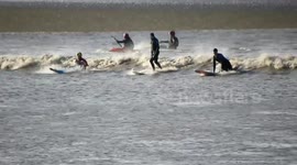 Kayakers and surfers take on UK river's tidal bore phenomenon