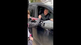 Manchester United boss Erik ten Hag signs young fans book on him