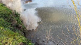 Local left soaked as Severn's bore crashes against riverbank