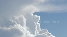 Time-Lapse of storm clouds rising up.