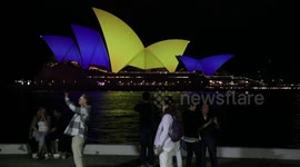Sydney Opera House is lit up on first anniversary of the invasion of Ukraine, Sydney, Australia