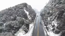 Snow falls on Los Angeles as city issued with first blizzard warning since 1989