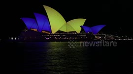 Sydney Opera House is lit up on first anniversary of the invasion of Ukraine, Sydney, Australia