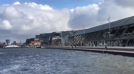 New riverside boardwalk opened up in Amsterdam - residents and tourist take first curious steps