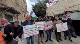 Activists demonstrate against the presence of Israeli settlers in Hebron and to commemorate the 1994 Ibrahimi Mosque massacre, in the centre of the West Bank town