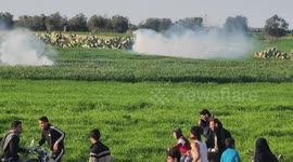 Israeli forces fire tear gas canisters towards Palestinian protesters as they gathering during anti-Israel demonstration