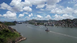 Tow boat enters bay to meet ships in port of Vitória - Brazil