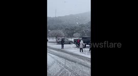 Residents left without power as rare winter storm brings rain and snow in southern California