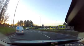 Caught near miss of two cars on roundabout due to poor lane discipline