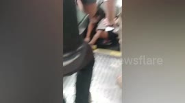 Japanese tourist rescued after getting her leg stuck in escalator