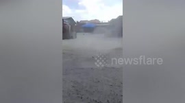Dust devil tornado follows family aboard tuktuk in the Philippines