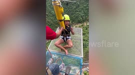 Hilarious reaction of woman afraid of heights as she does bungee jump