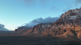 Drone video time-lapse of the Wilson Cliffs at Red Rock Canyon National Recreation Area just outside Las Vegas on a cold morning.