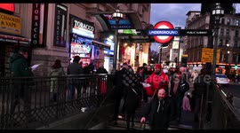 Entering Piccadilly Circus Underground Station in the evening, London, United Kingdom