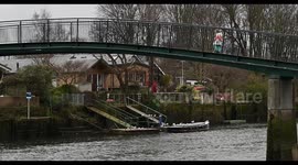 Child crossing the Eel Pie Island Bridge in Twickenham, London, United Kingdom