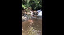 Woman ALMOST cracks her head open while posing on a slippery rock