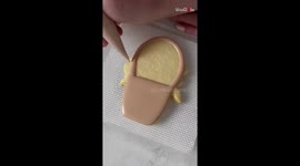 Cookie artist flexes her superfine piping game while decorating an uber-detailed 'flower basket' cookie