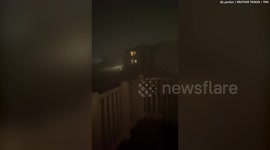 Video shows heavy rain and flashes of lightning as tornado passes through Norman, Oklahoma