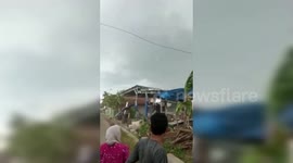 Residents sprint for cover as tornado rips through Indonesia village