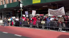 People chant at the CUNY staff rally in New York, USA