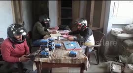 As roof crumbles, power department staff works with helmets on their heads