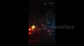 Newsflare Edit - Fire explosion of gas main in front of house, neighbors frantically rushing to put it out incorrectlywith water hoses and are in possible danger!