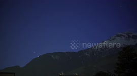 Jupiter and Venus seen setting behind Alps in Switzerland
