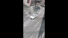 Man with good intentions slips on icy ground and just keeps sliding against his will