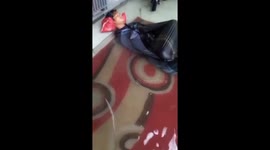 Flooding Wake-Up Call: Guy Sleeps Through Flood After Late-Night Gaming on Terrace in Makassar, Indonesia