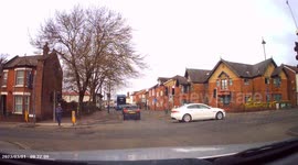 DASHCAM: Bus vs. Car! Car on right-turn filter, pulls across in front of BUS, forcing BUS to brake hard! Then drives on wrong side of kept-left sign and blocks pedestrian crossing!