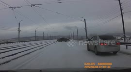 Accident: Black Car Loses Control and Starts Hydroplaning on Icy Road
