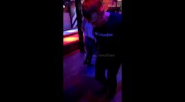 Girl drowning in phone gets in the way and collides with a man doing giddy