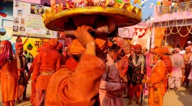 Women beat men with sticks during Lathmar Holi celebrations in northern India