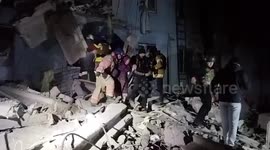 Rescuers search through rubble and use ladder to evacuate survivors in Zaporizhzhia, Ukraine
