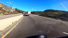 Close Call: Reckless Truck Driver Almost Pushes Car Into a Jersey Barrier